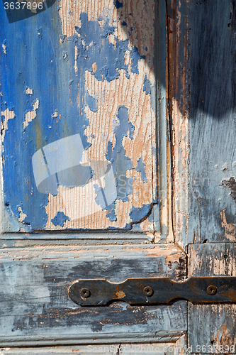 Image of in the old wall  blue wood  metal