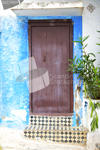 Image of historical blue  in  antique building door morocco      style af