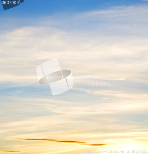 Image of sunrise in the colored sky white soft clouds and abstract backgr