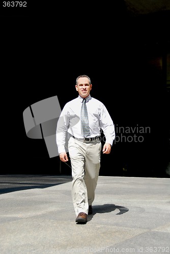 Image of Businessman walk