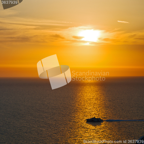 Image of in santorini    greece sunset and the boat