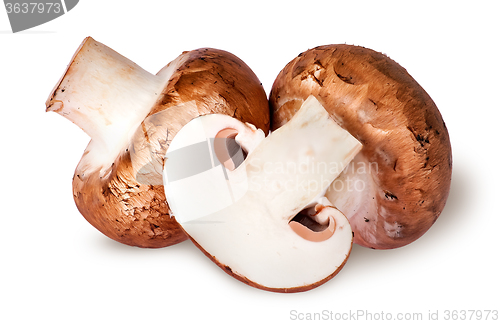 Image of Two whole and half brown champignons