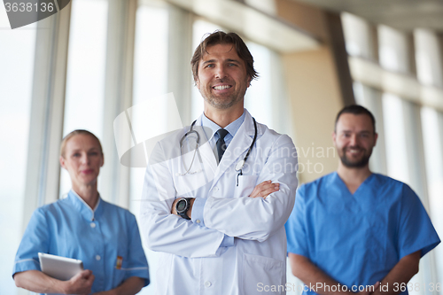 Image of group of medical staff at hospital, handsome doctor in front of 
