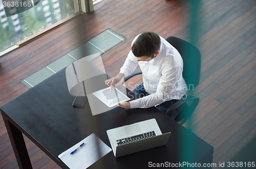 Image of top view of young business man at office