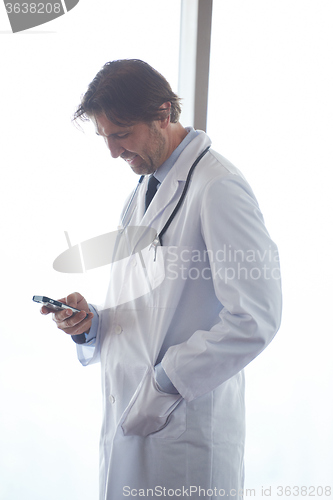 Image of doctor speaking on cellphone