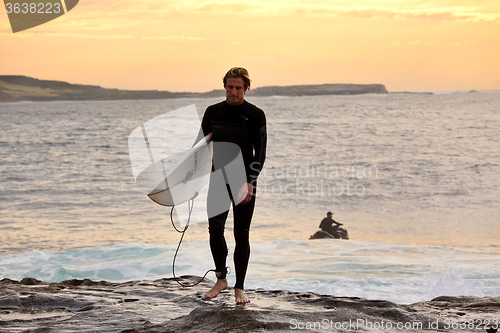 Image of Sunrise surfer at Cape Solander Australia