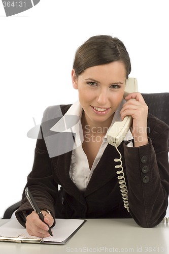 Image of Businesswoman taking notes