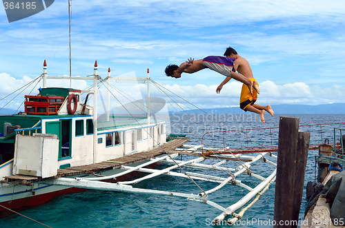 Image of Diving Asian boys in port