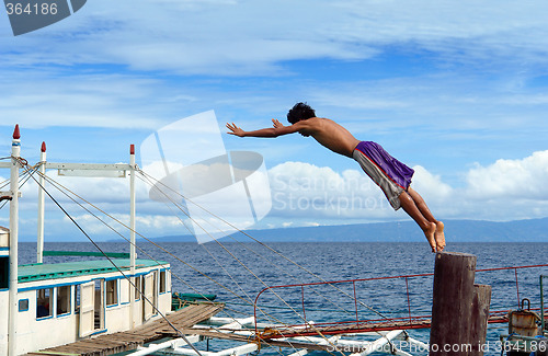 Image of Diving Asian boy in port