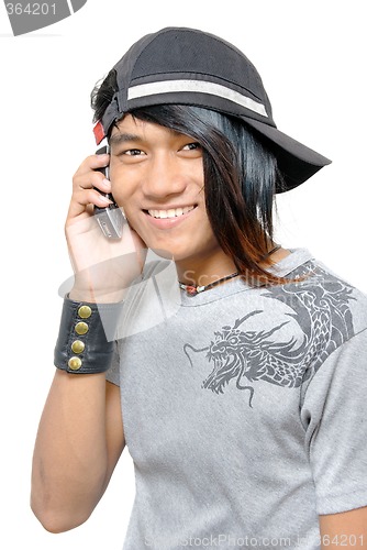 Image of Asian punker calling by cell phone