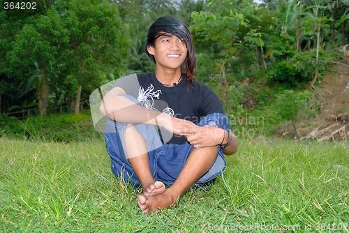Image of Asian punk teenager on lawn