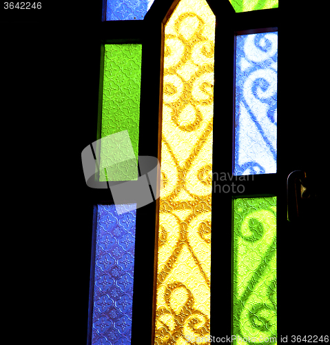 Image of colorated glass and sun in morocco africa window and light