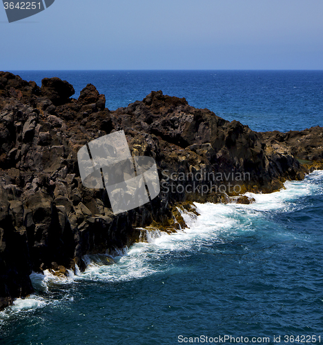 Image of people stone volcanic spain  water coast 