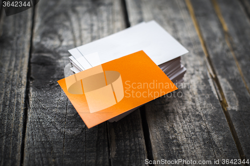 Image of Orange business card identity mockup on wood