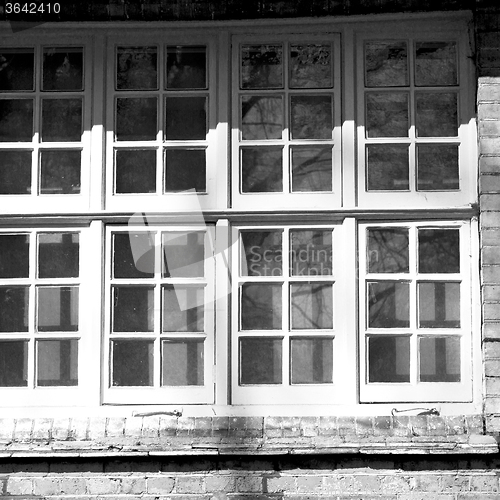 Image of old windon in england london brick and glass the wall 