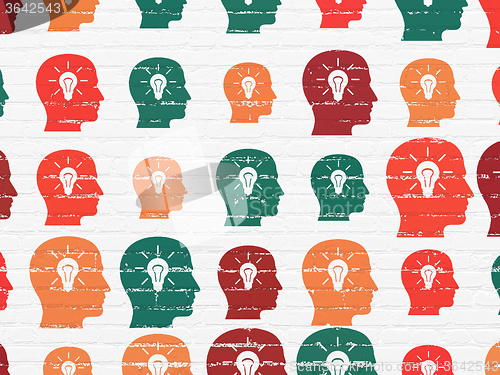 Image of Advertising concept: Head With Light Bulb icons on wall background