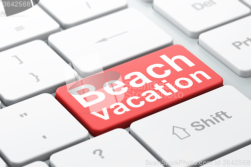 Image of Travel concept: Beach Vacation on computer keyboard background