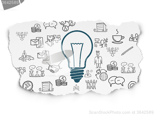 Image of Business concept: Light Bulb on Torn Paper background