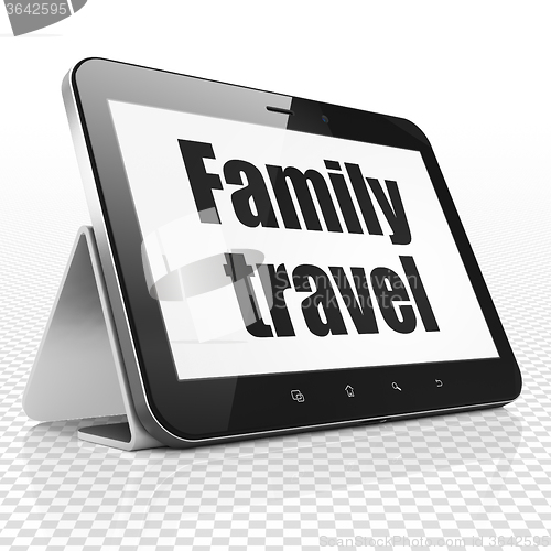 Image of Tourism concept: Tablet Computer with Family Travel on display