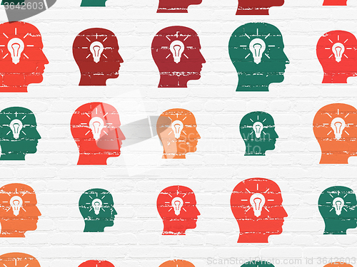 Image of Information concept: Head With Light Bulb icons on wall background