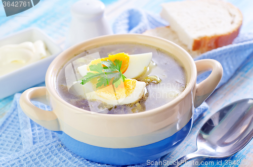 Image of green soup with boiled eggs