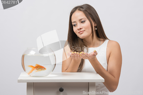 Image of She asks goldfish fulfill the desire