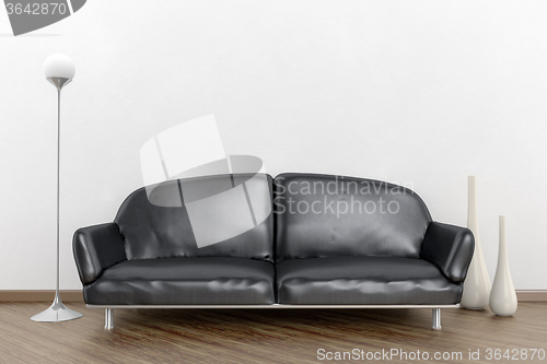 Image of black sofa in a white room