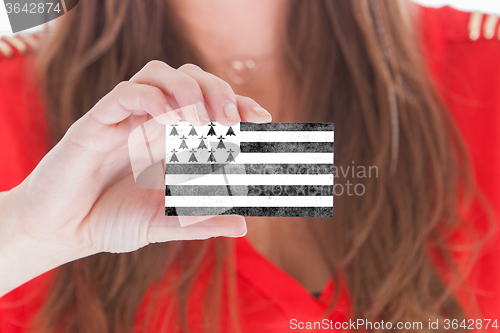 Image of Woman showing a blank business card