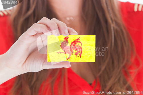 Image of Woman showing a blank business card