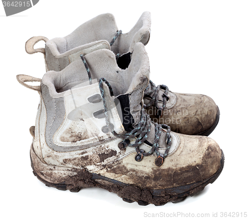 Image of Pair of old dirty trekking boots
