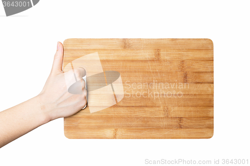 Image of hand holding chopping board