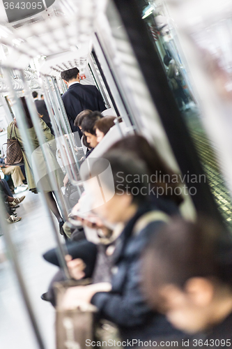 Image of Passengers traveling by Tokyo metro.