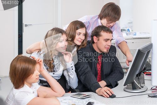 Image of Business team of five planning work in office