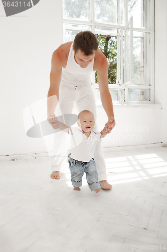 Image of young father with his nine months old son at home