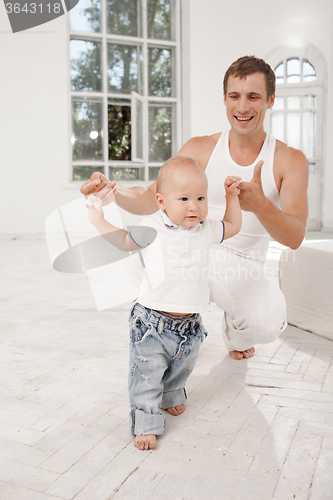 Image of young father with his nine months old son at home