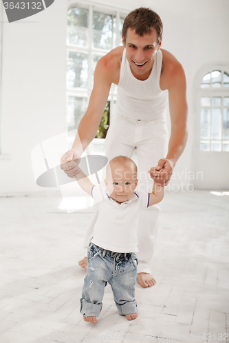 Image of young father with his nine months old son at home