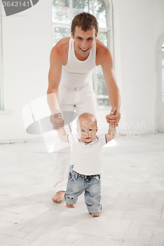 Image of young father with his nine months old son at home