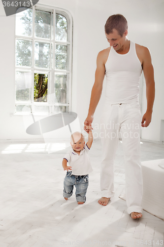 Image of young father with his nine months old son at home
