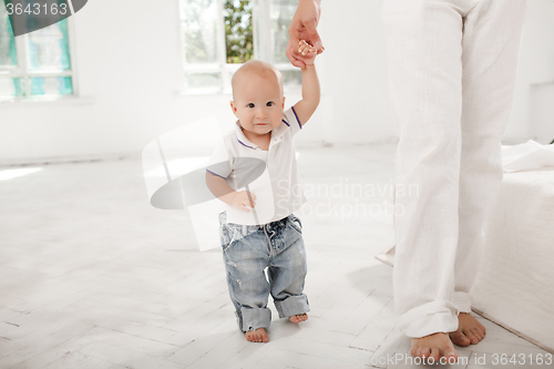 Image of young father with his nine months old son at home