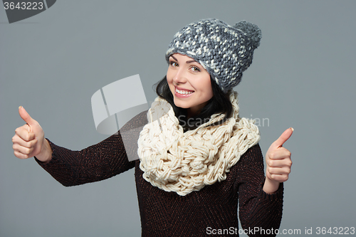 Image of Woman giving double thumbs up