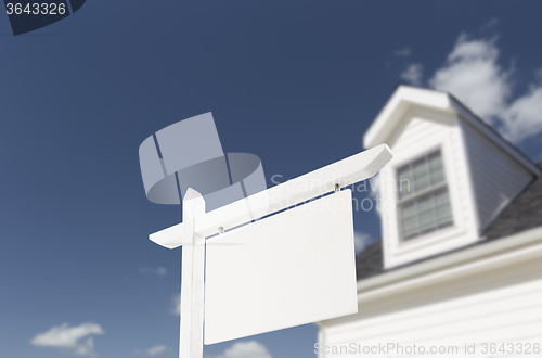 Image of Blank Real Estate Sign in Front of New House 