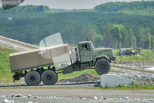 Image of URAL truck comes through on high obstacle