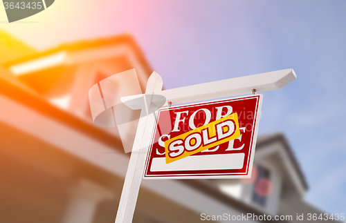 Image of Sold Home For Sale Sign in Front of New House