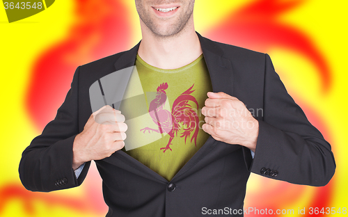 Image of Businessman opening suit to reveal shirt with flag