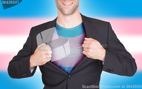 Image of Businessman opening suit to reveal shirt with flag