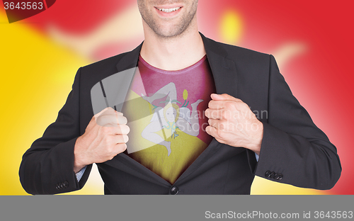 Image of Businessman opening suit to reveal shirt with flag