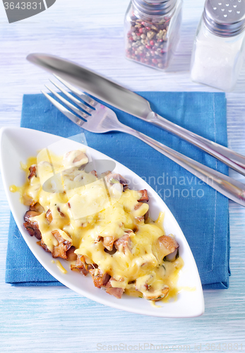 Image of fried meat with mushroom and cheese