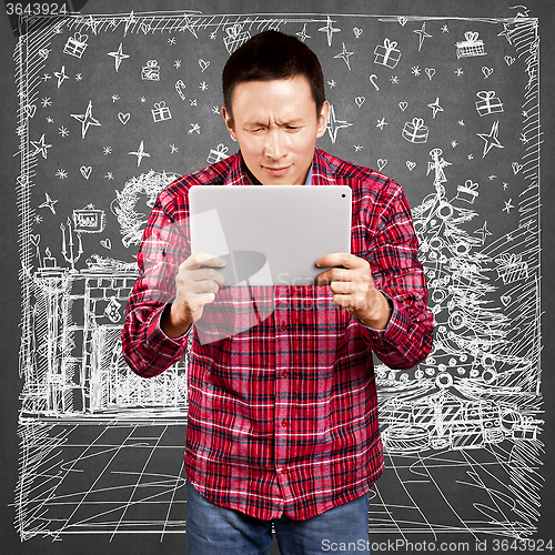 Image of Man Looking For Christmas Gifts