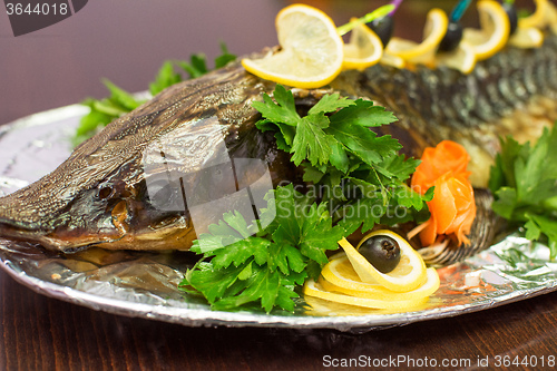 Image of sturgeon baked with greens 