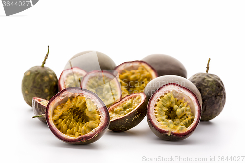 Image of Flesh Of Halved Passionfruits In Their Hard Rind